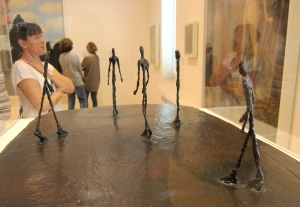 Visitor-Looking-at-Sculptures